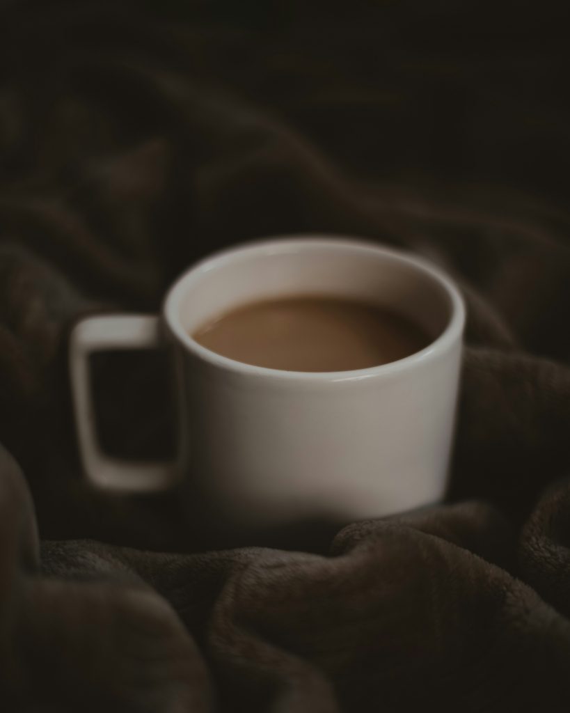 Cozy moment taking tea while on the bed